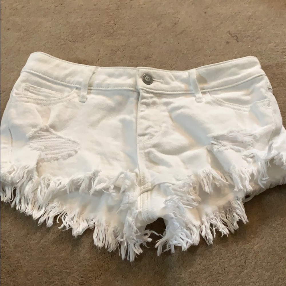 Fringed white shorts